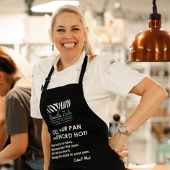 Chef Mel Cooking in apron cooking coach
